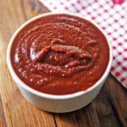 Sugar-free BBQ sauce is served in a white bowl with a napkin.