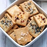 Almond flour crackers are served in a white bowl.