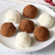 Keto cheesecake bites are served on a white plate.