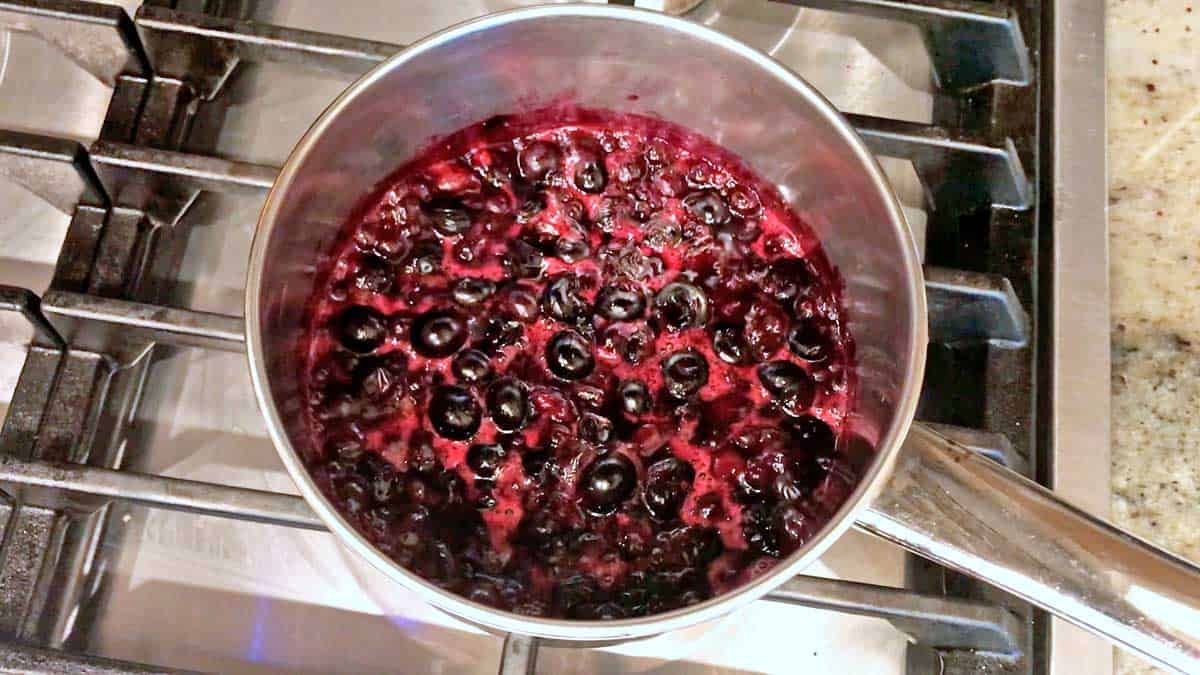 Blueberry compote is almost done cooking.