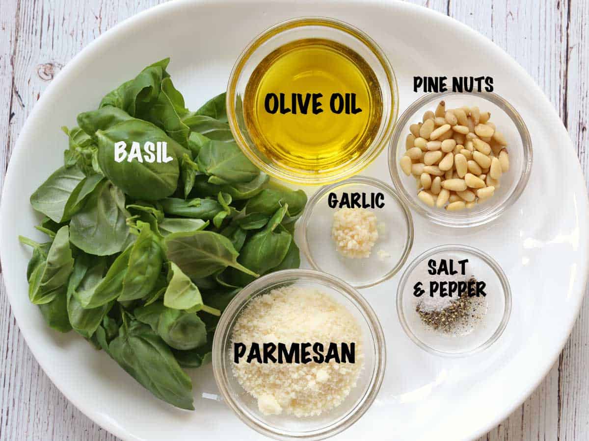 The ingredients needed to make homemade pesto sauce.