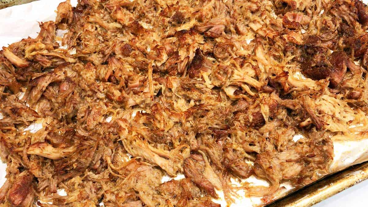 Arrange the carnitas on a rimmed baking sheet and broil them.