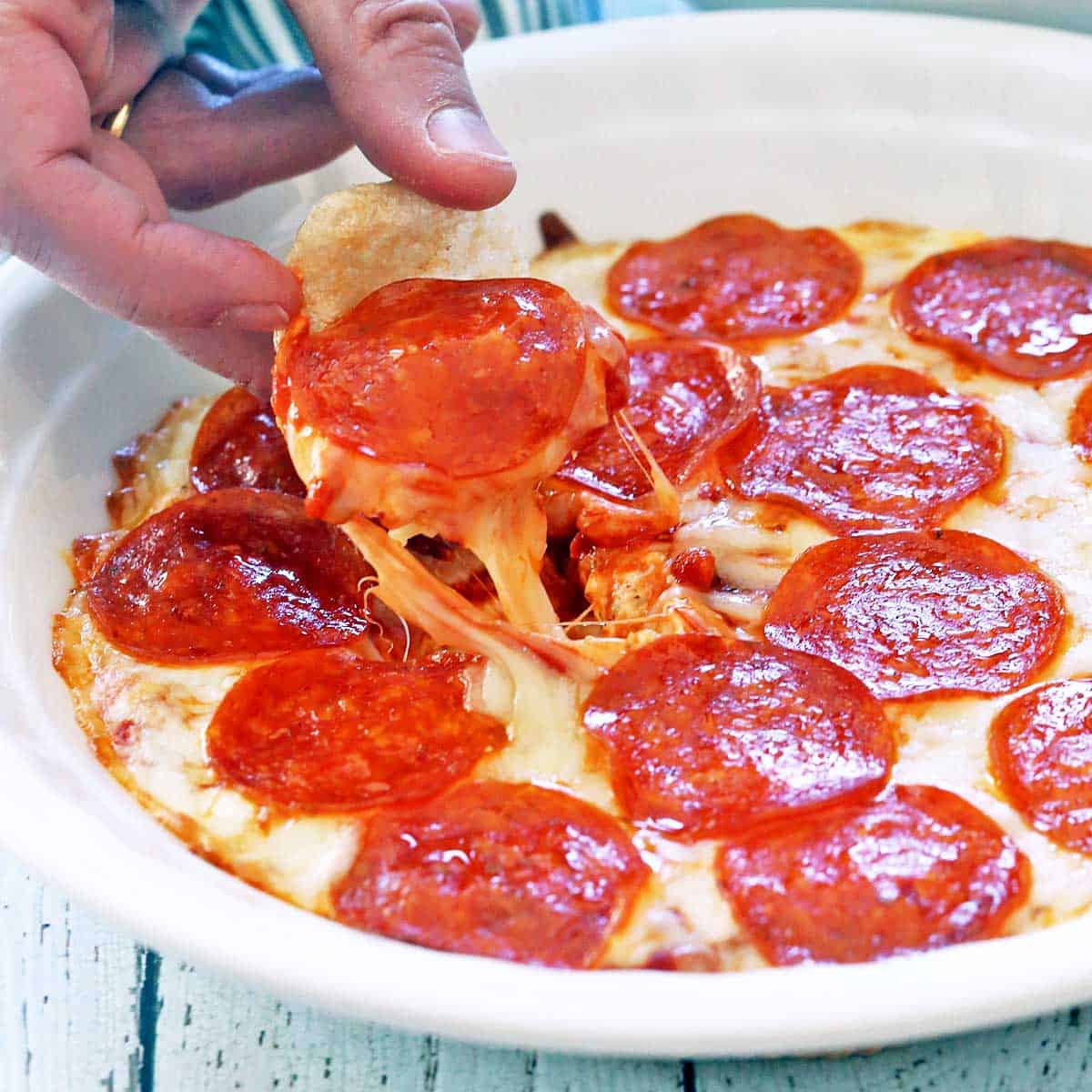 Scooping out pizza dip.