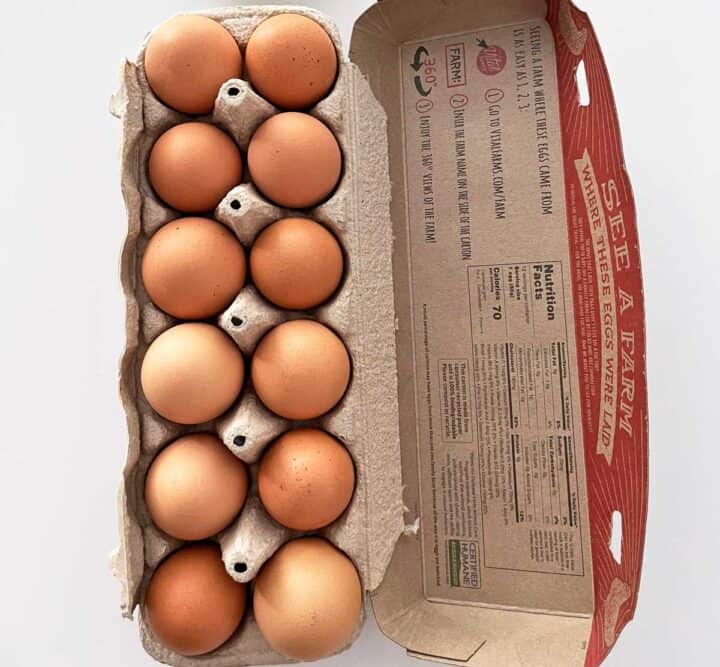 A carton of eggs on the counter.
