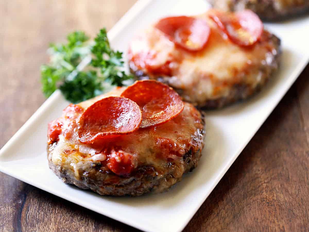 Mini Meatzzas are served on a white tray.