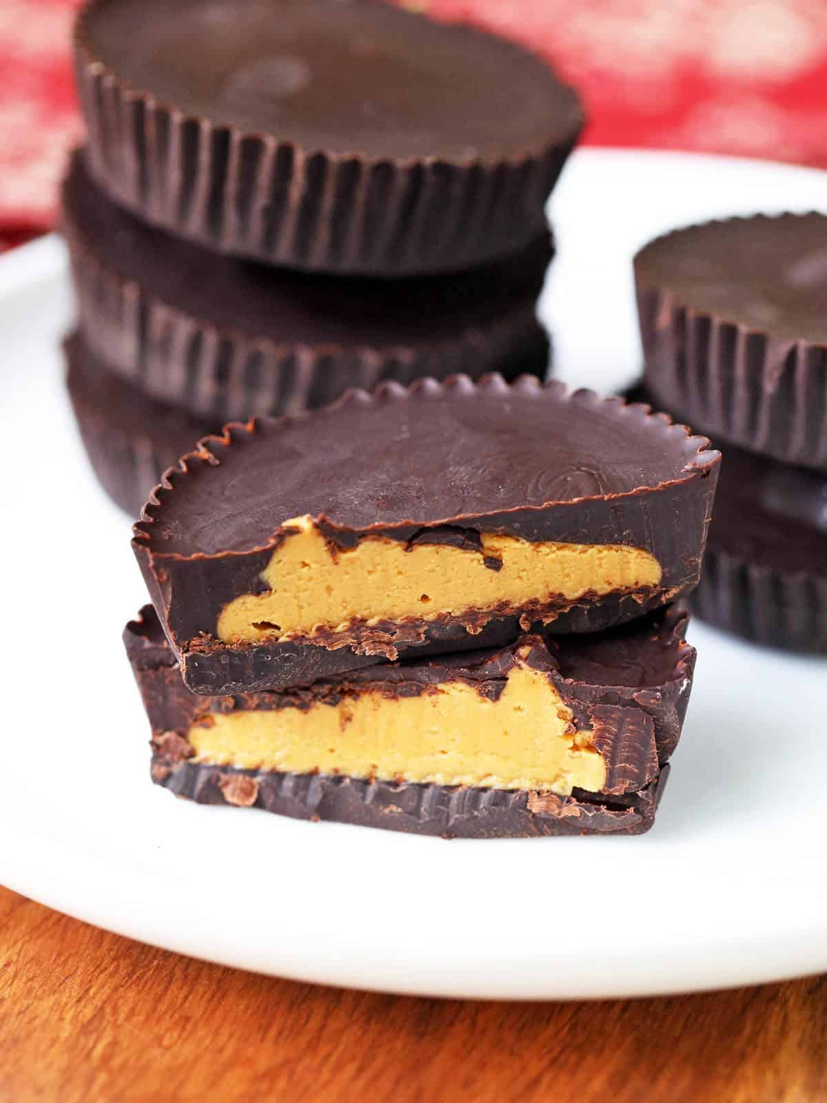 Keto peanut butter cups are served on a white plate. 