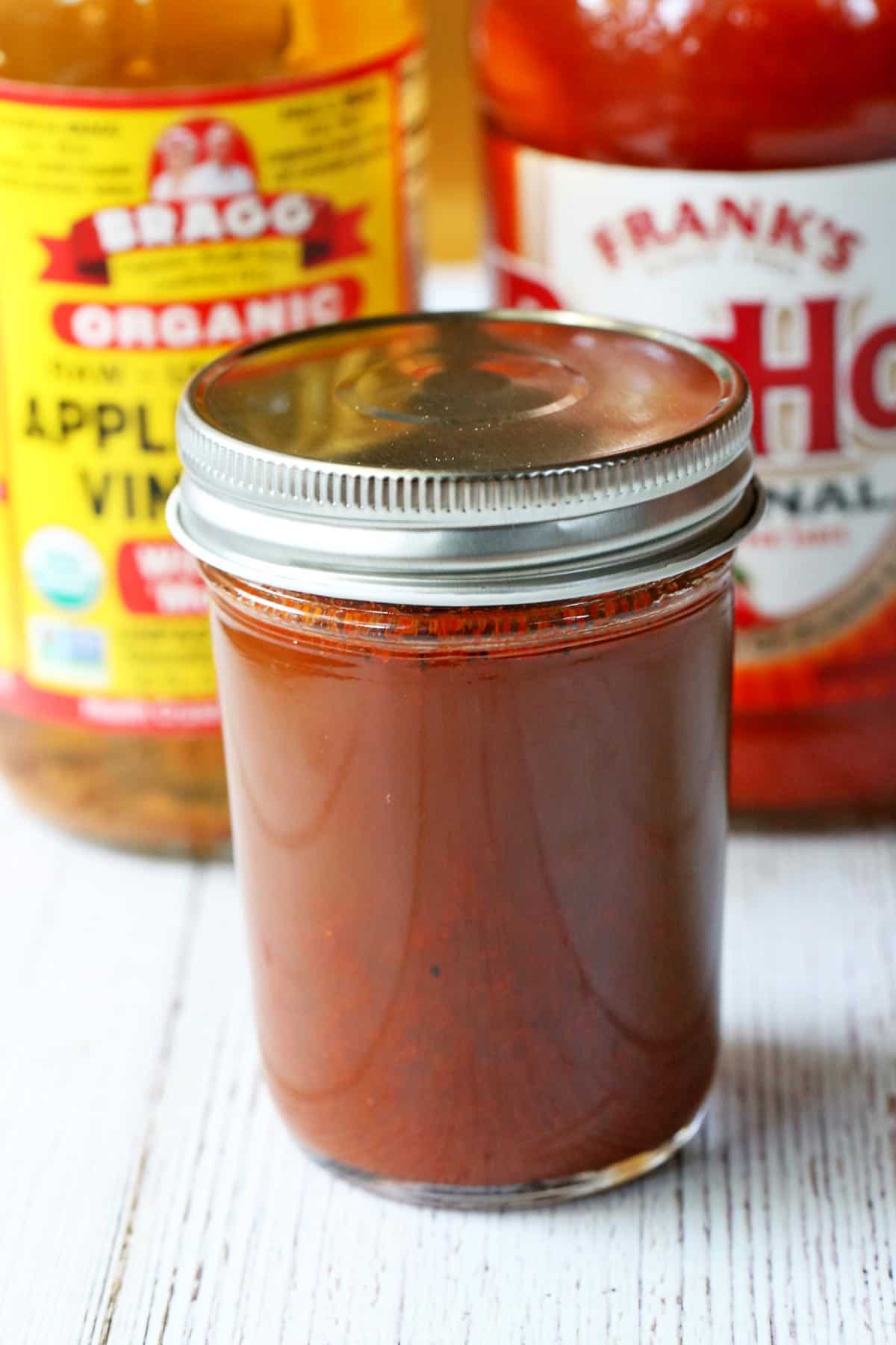 Carolina BBQ sauce is stored in a glass jar. 