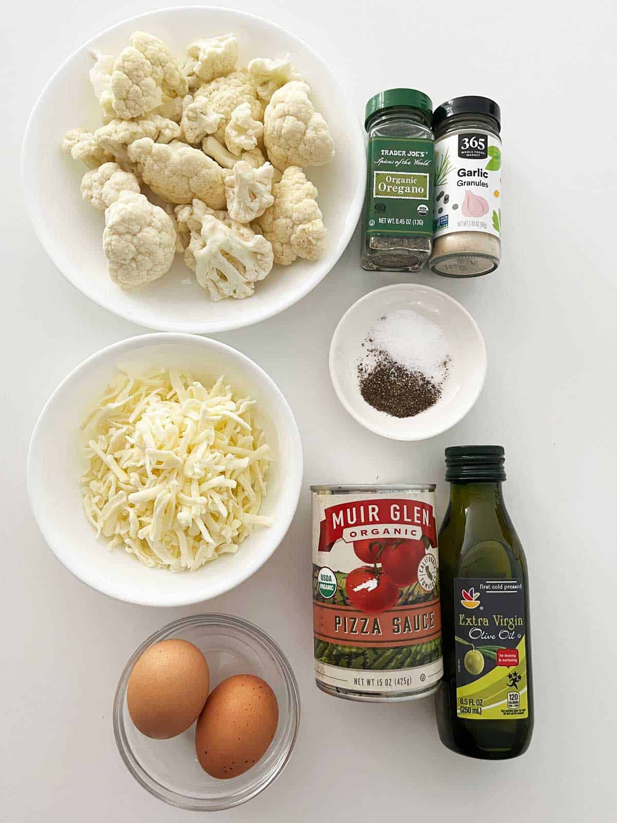 The ingredients needed to make a cauliflower pizza crust.