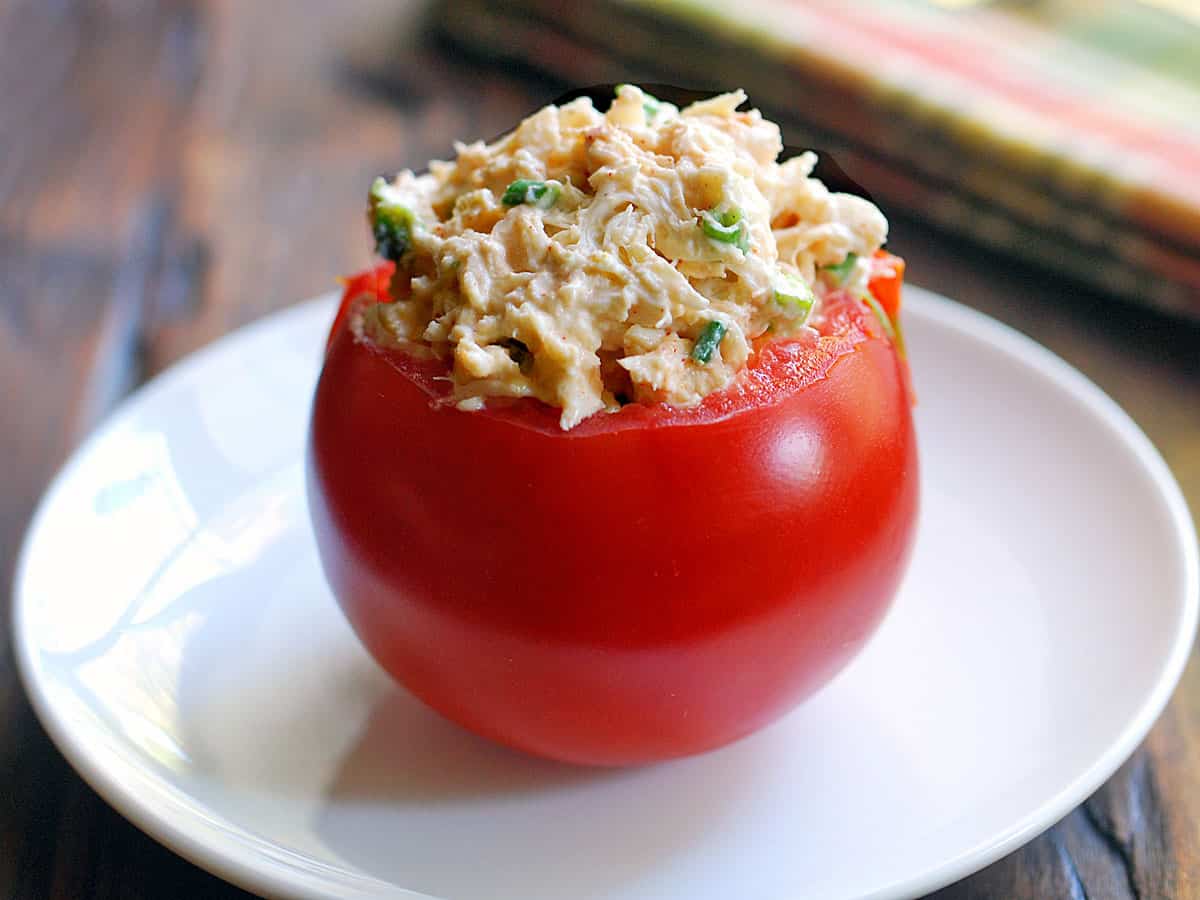 Crab salad stuffed inside a tomato.