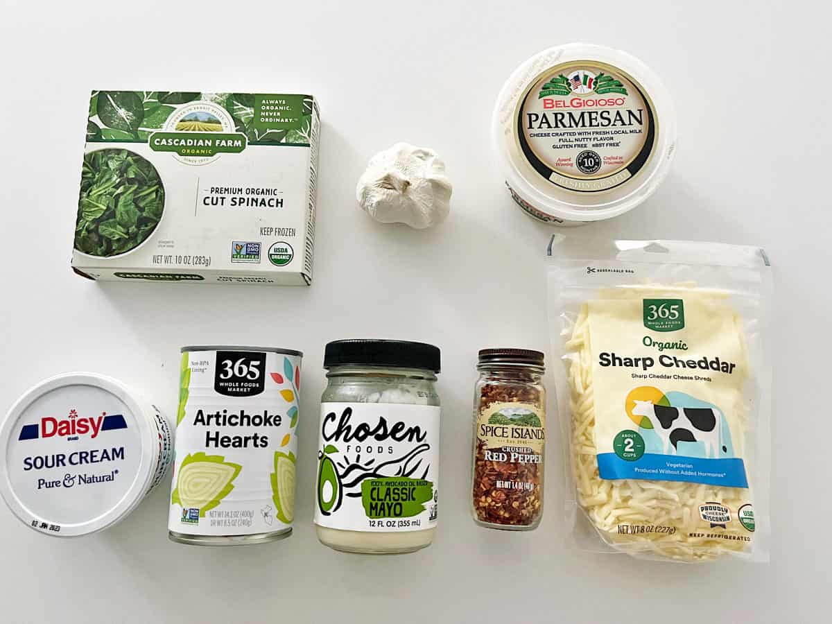 The ingredients needed to make a spinach artichoke dip.