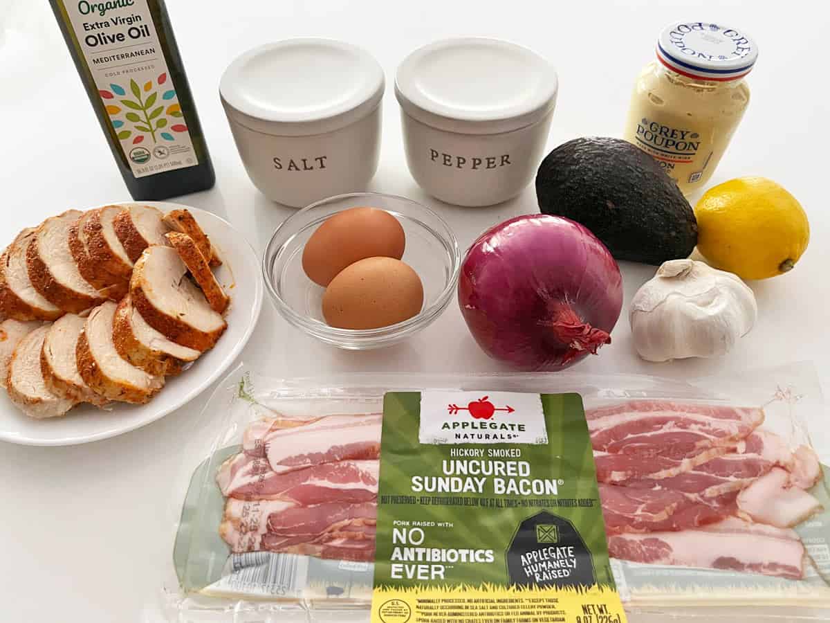 The ingredients needed to make an avocado chicken salad.