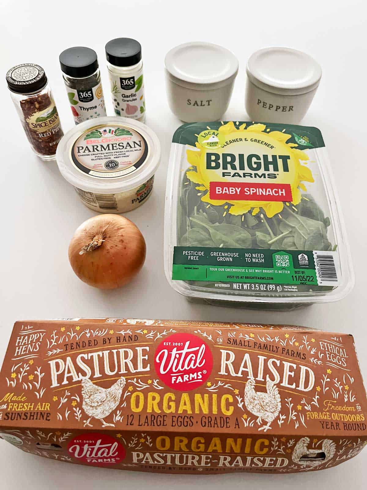 The ingredients needed to make a spinach frittata.