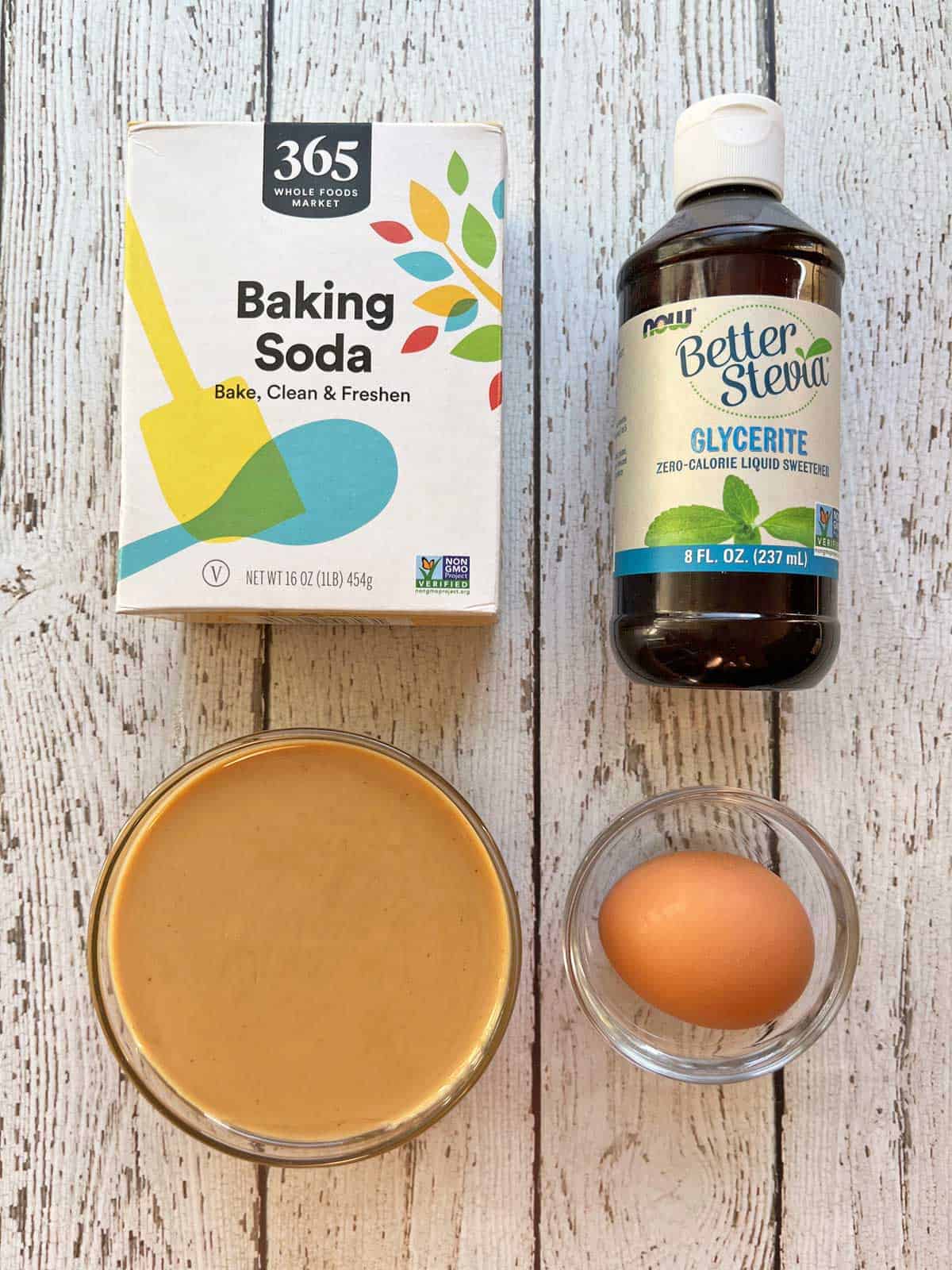 The ingredients needed to make a keto peanut butter mug cake.