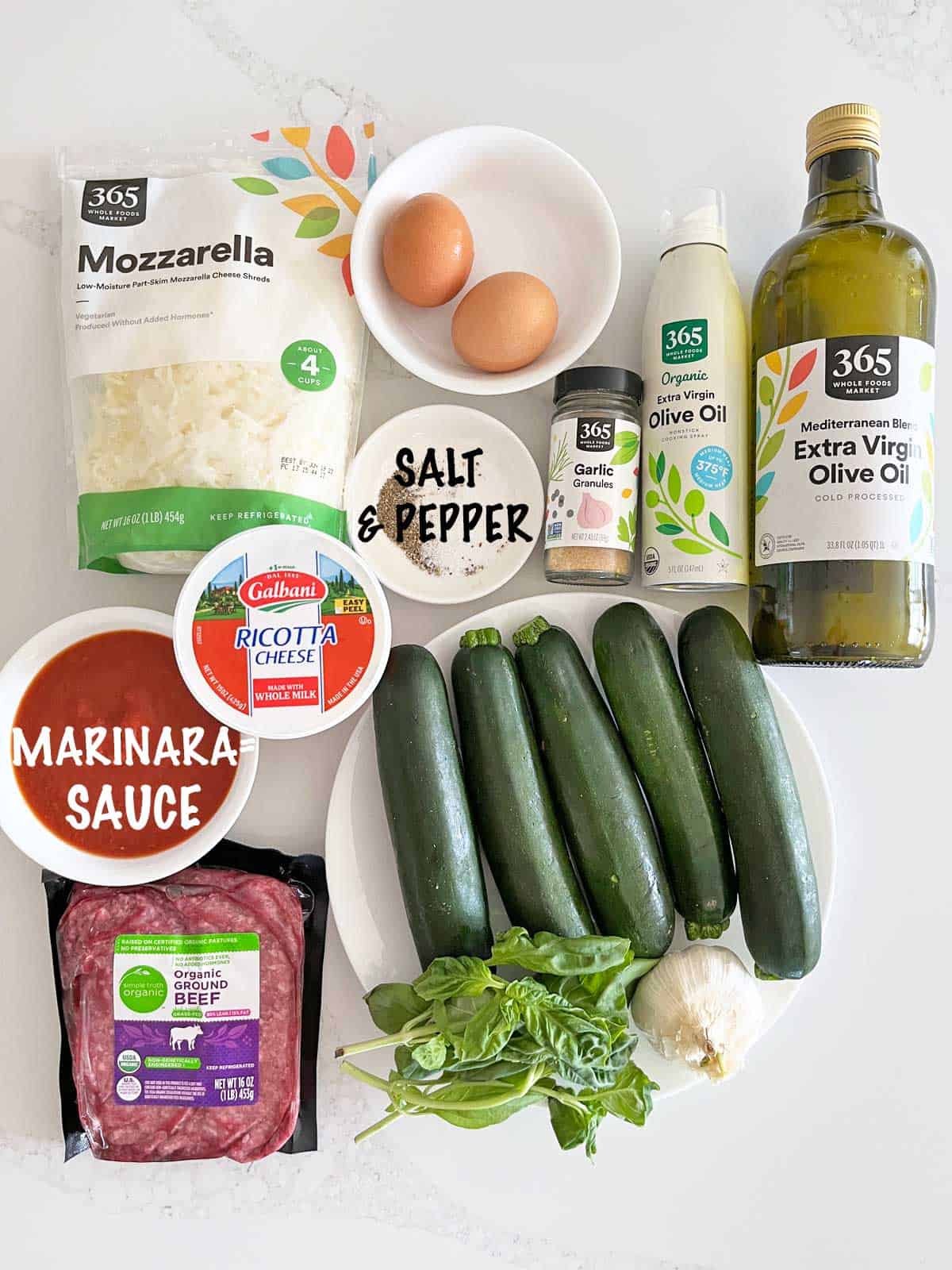 The ingredients needed to make zucchini lasagna.