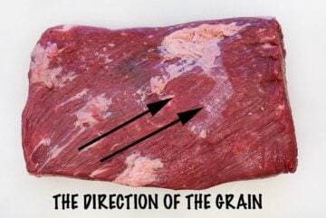 The direction of the grain in a raw brisket.