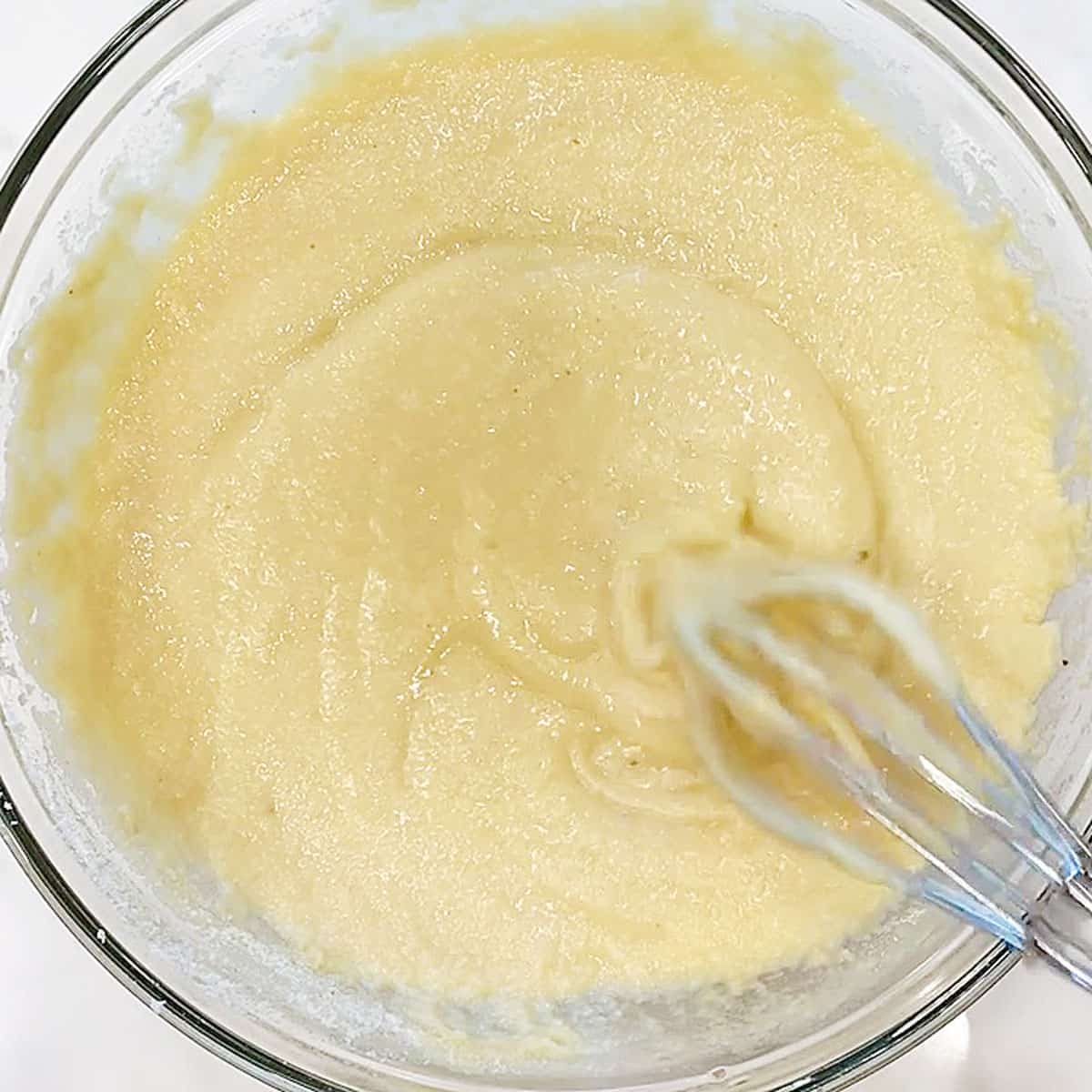 Adding the dry ingredients to the bowl.
