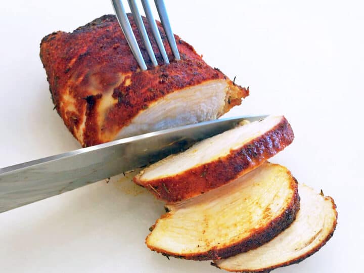 Slicing blackened chicken.