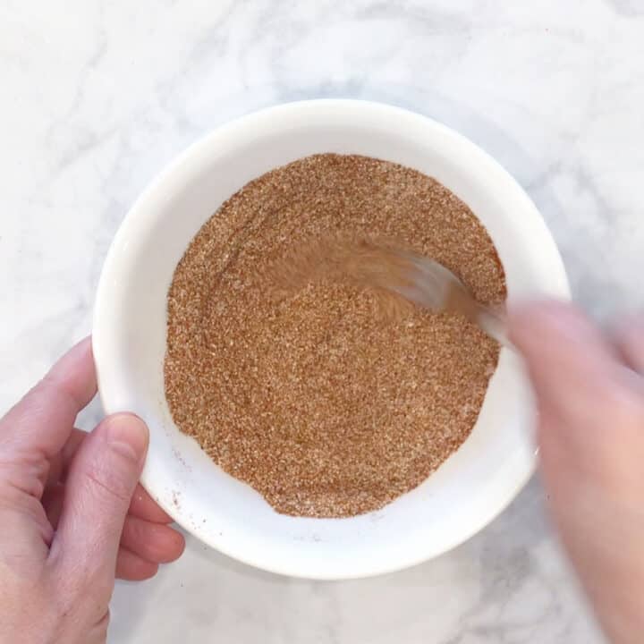 Mixing spices in a bowl.