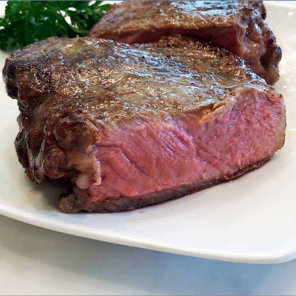 A reverse sear steak cut in half.