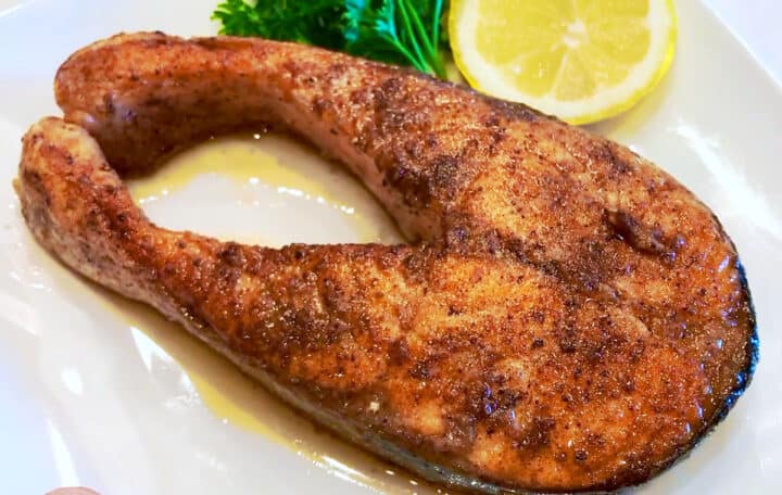 Salmon steak is served.