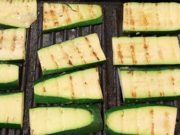 Grilling zucchini slices.