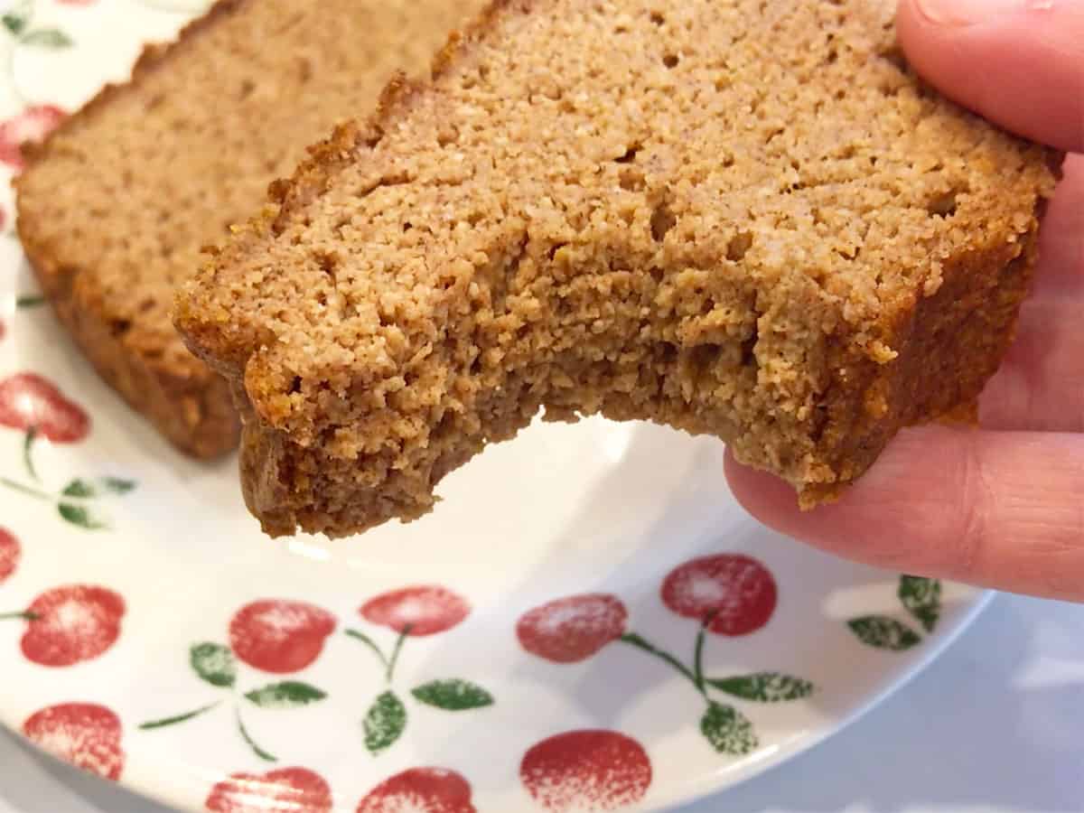 A closeup look at a slice of keto pumpkin bread to highlight its texture.