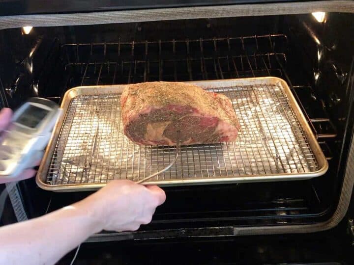 Placing the roast in the oven.