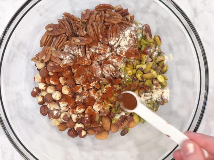 Add spices to the nuts.