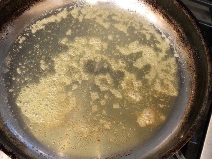 Melting butter in a skillet.