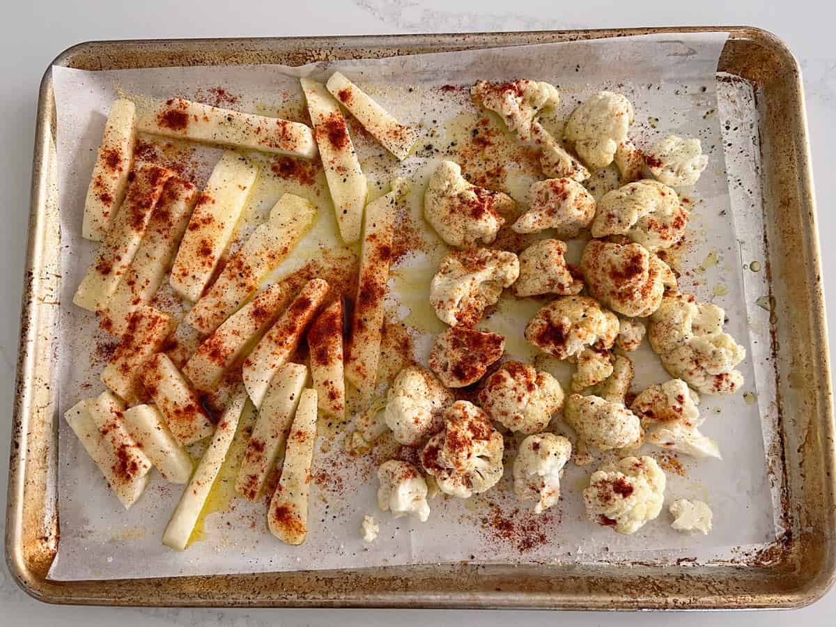Jicama and cauliflower on the same baking sheet.