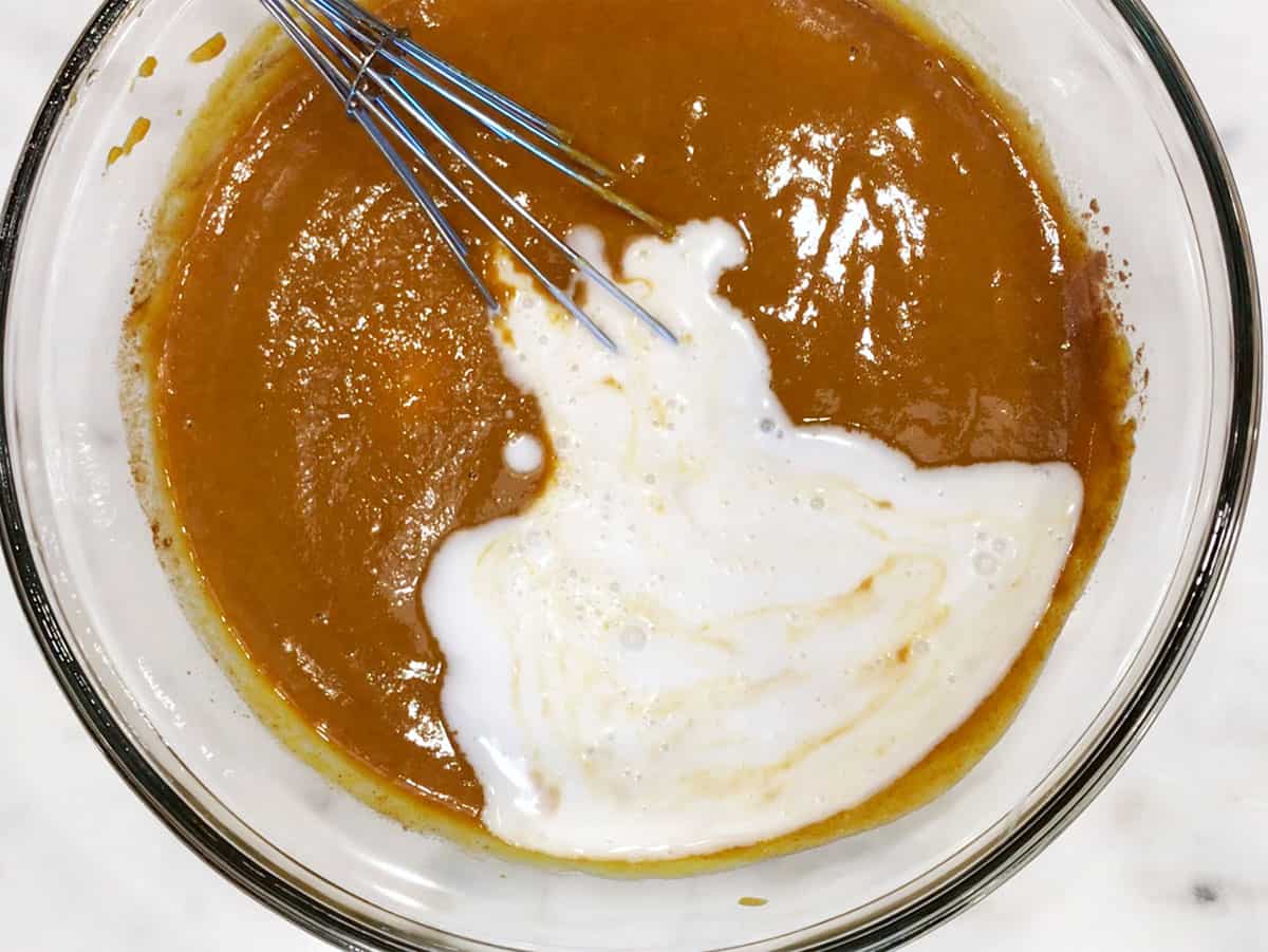 Adding coconut milk. 