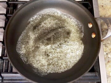 Melting butter in a skillet.