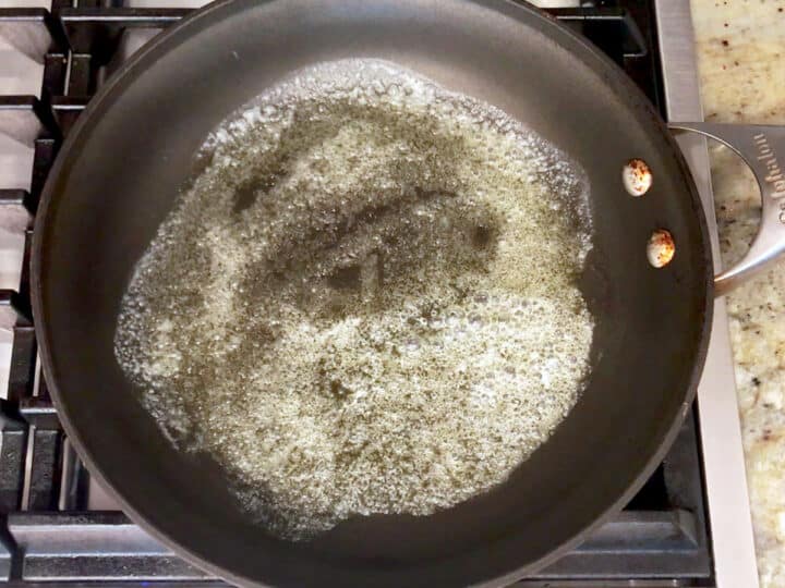 Melting butter in a skillet.