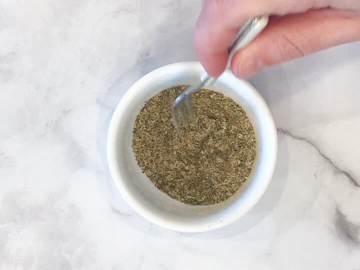 Mixing spices in a bowl.