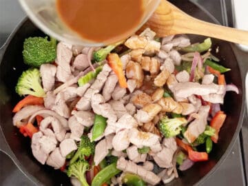 The pork and sauce were added to the veggies in the skillet.