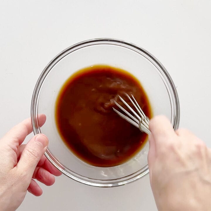 Mixing the sauce for a pork stir-fry.