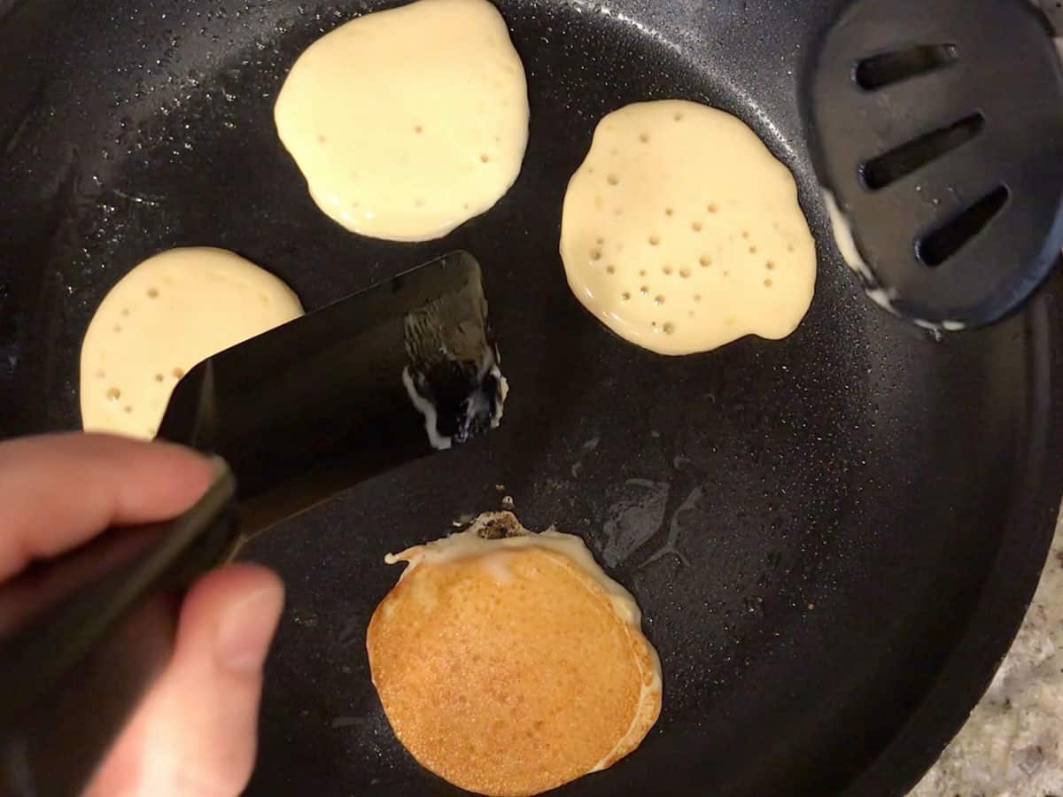 Flipping the pancakes.