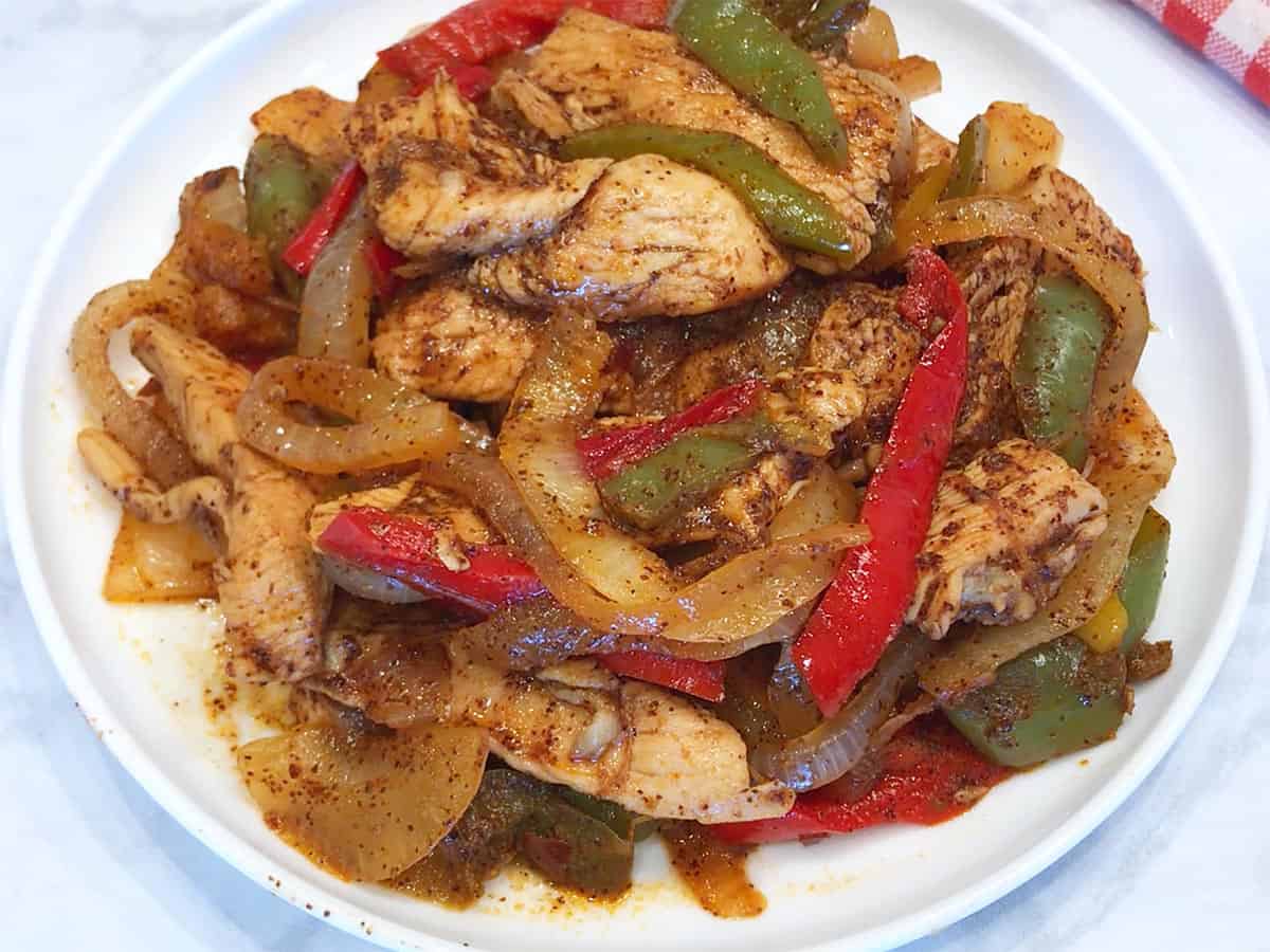 The fajitas are served on a plate.