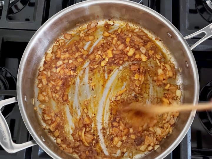 Adding garlic, spices, and maple syrup.