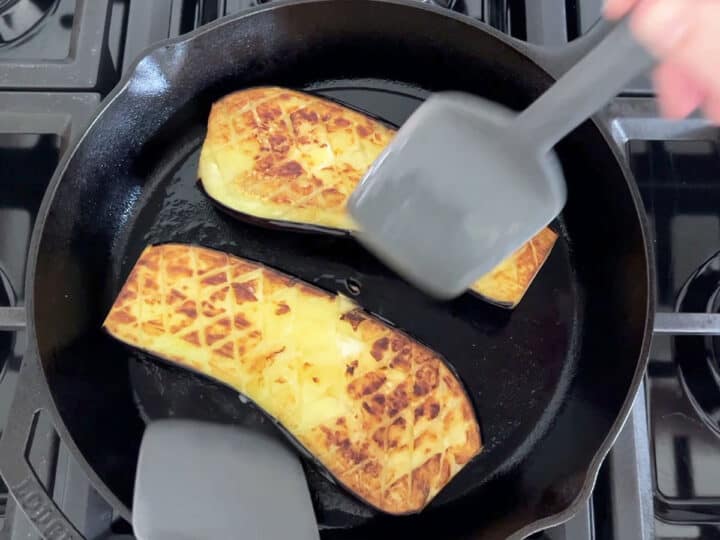 Flipping the eggplant.