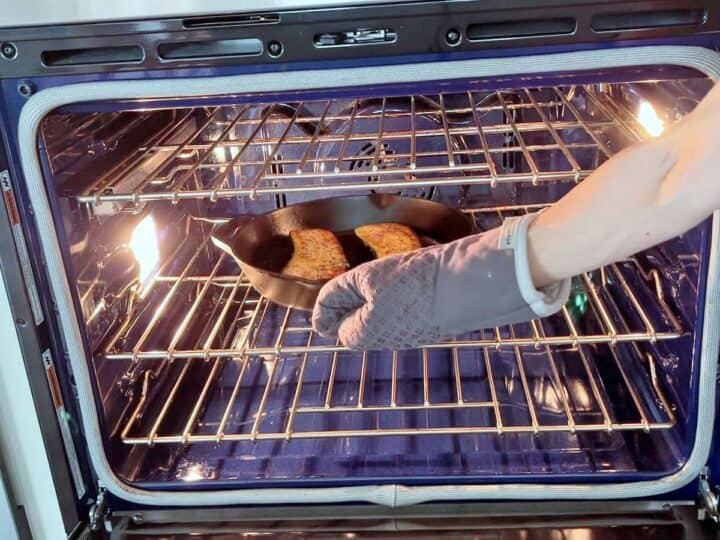 Placing the eggplant in the oven.