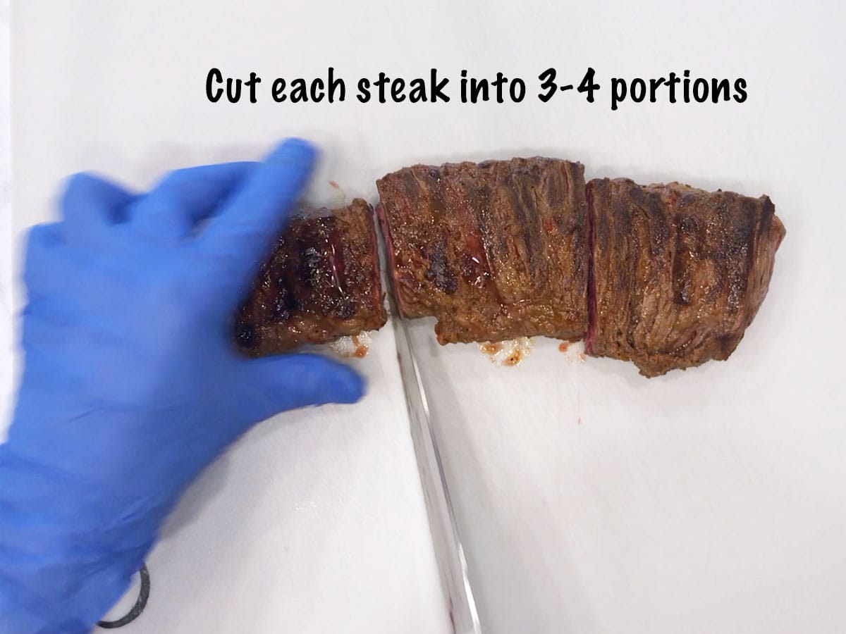 Cutting the steak into portions.