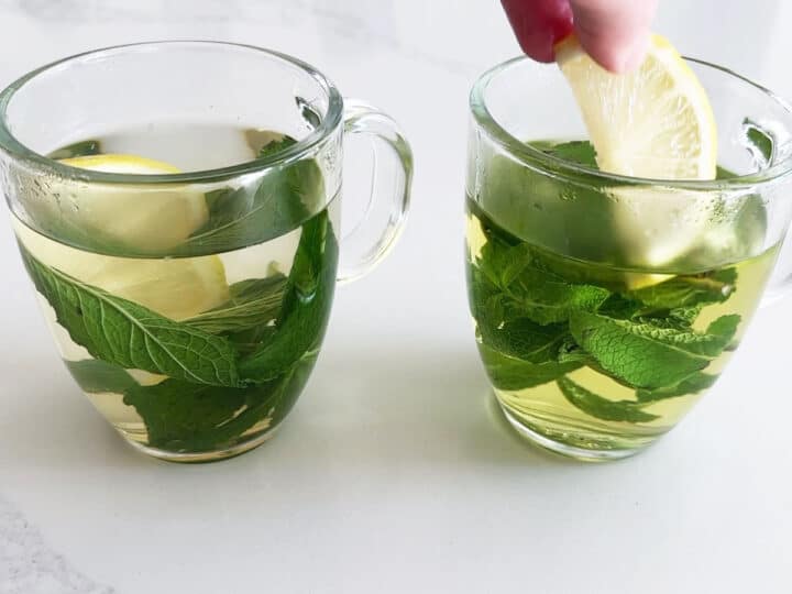 Adding lemon to mint tea.