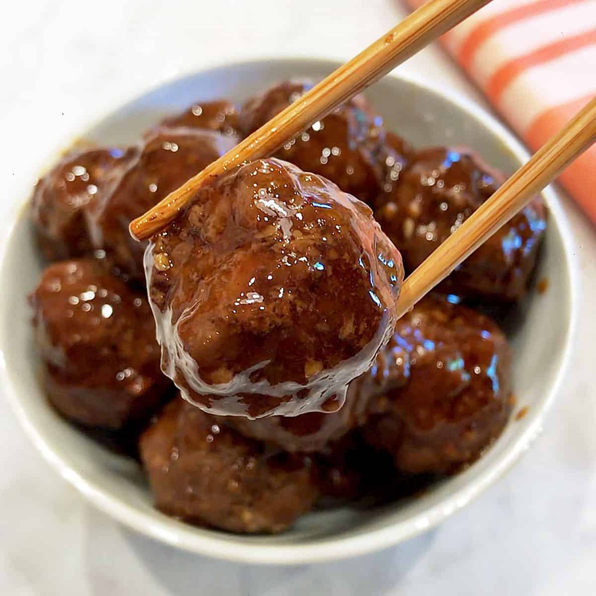 Serving the meatballs.