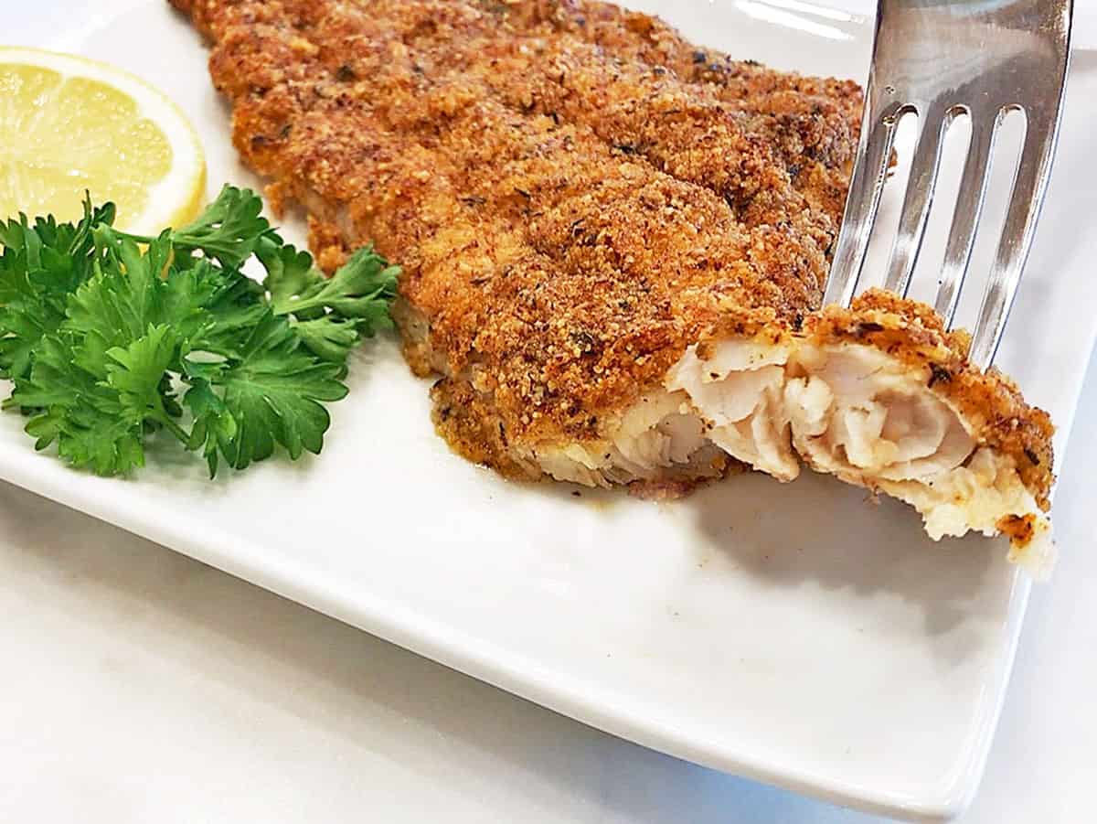 The inside of a fully cooked baked catfish.