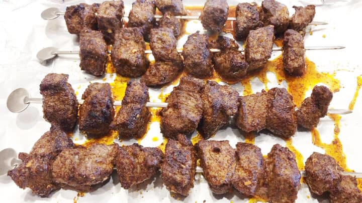 The kabobs are ready in the pan.