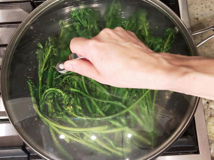 Covering the skillet.