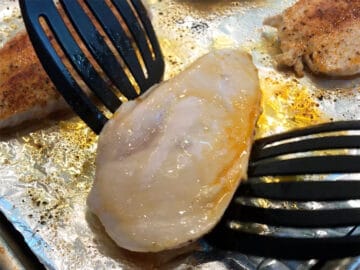 Flipping the chicken.