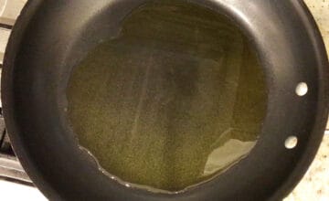 Heating the olive oil in the skillet.