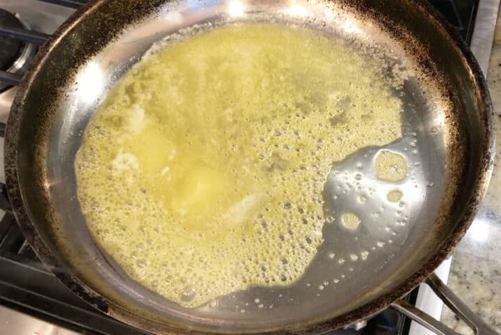Melting butter in a skillet.